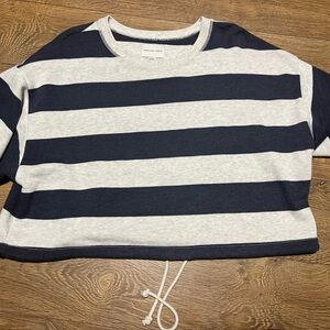 Cropped sweater like short sleeve with synching at the waist!